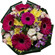 Rumba. Tight, rich round bouquet of gerbera daisies, spray roses, chrysanthemums and alstroemerias.
